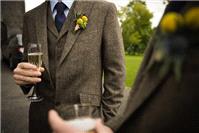 Tweed suit with blue tie